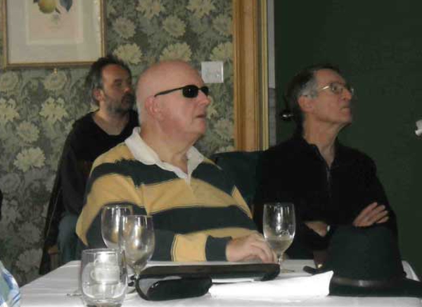 Foreground: Leigh Hogg, Eric Cogswell.
                Background: Glen Archer.