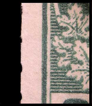 Magnified view of part of the second fake 2 cent green endwise 
        coil showing traces of perforation holes on the left side