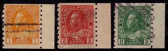 1 cent yellow, 2 cent carmine, and 2 cent green sidewise coil 
        stamps with a piece of selvedge attached to the right side of the stamp
